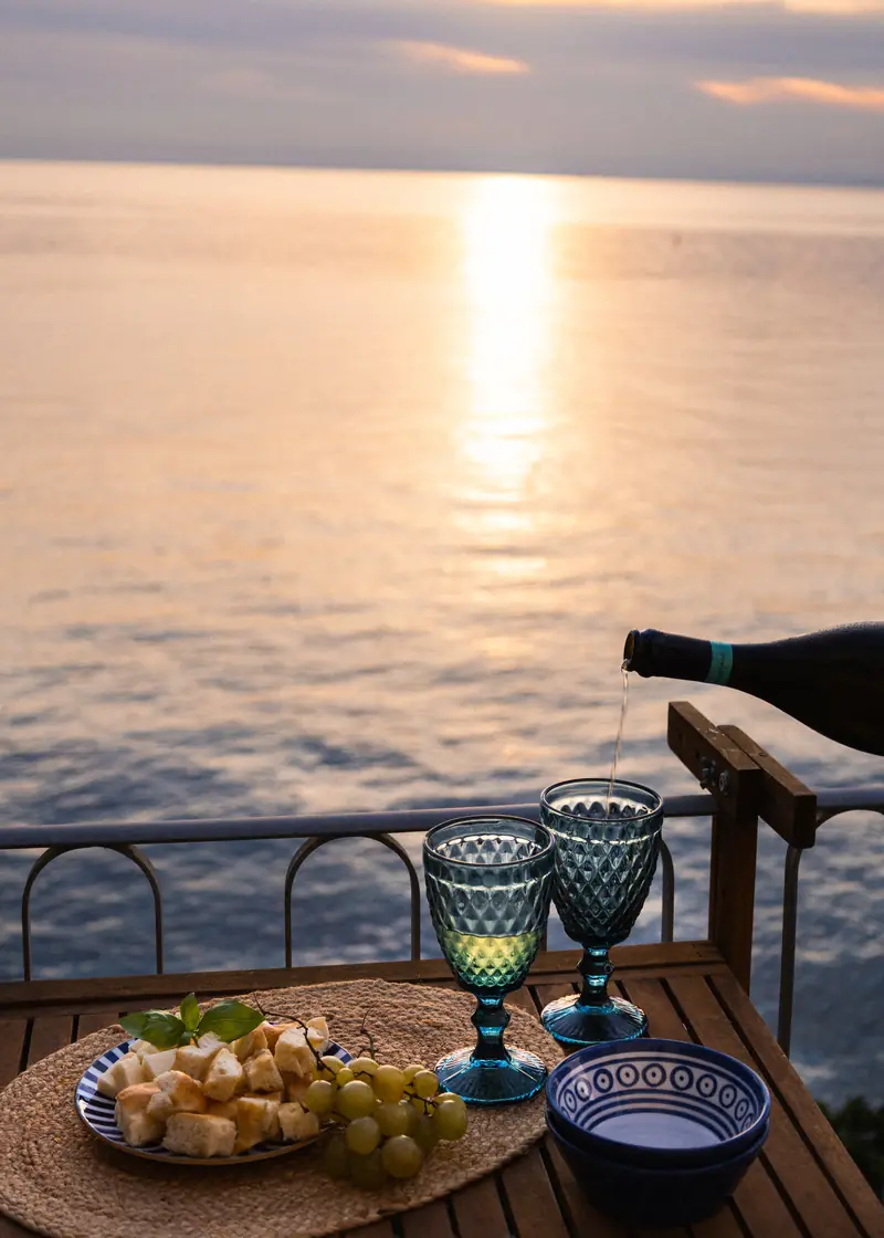 Sparkling wine poured at sunset on the terrace