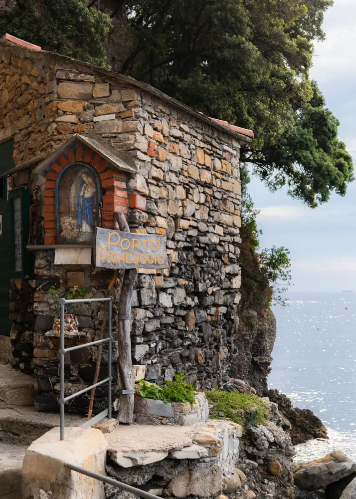 A stone shrine along the trail above the sea