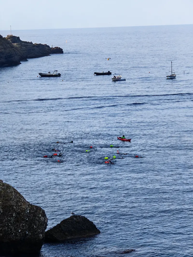 Kayaks and boats on the calm sea
